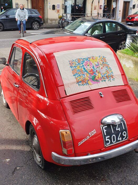 Fig. 7: A bright red Fiat 500 remains parked in Piazza dell’Immaginario throughout the art performance.